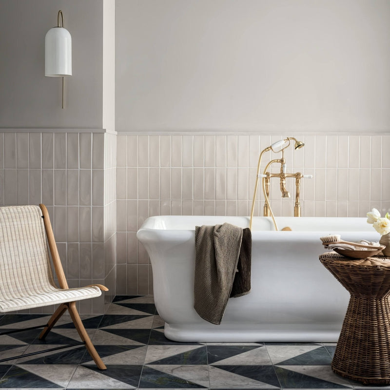Alhambra White 7.5 x 22.5 Rectangular Glazed Tile white glazed tiles with a clawfoot bathtub and gold fixtures
