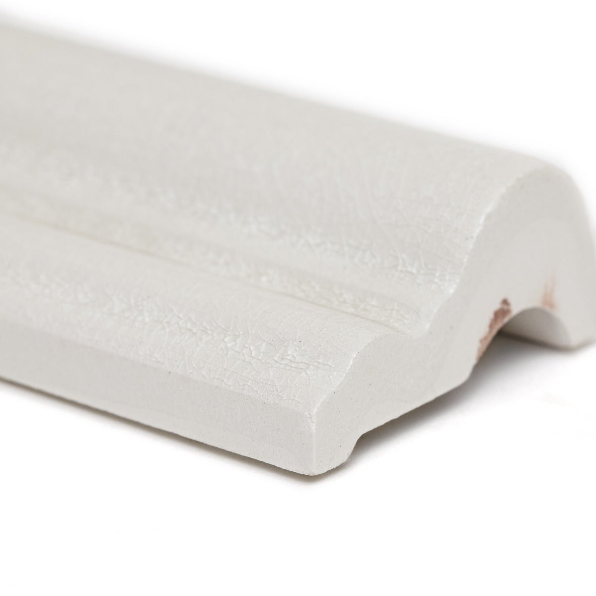 Alhambra white dado glazed ceramic crown molding with smooth textured surface and subtle decorative grooves