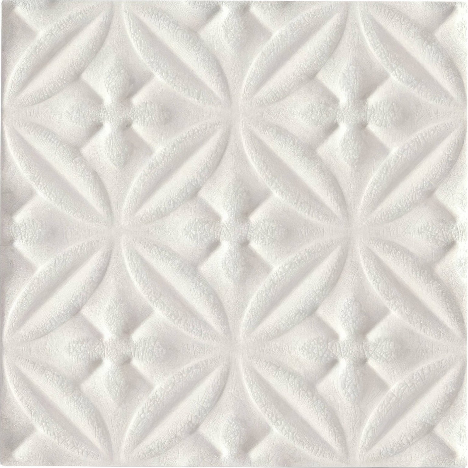 Alhambra white decor glazed tile with white textured panel featuring raised diamond shapes and leaf-like motifs