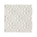 Alhambra white decor glazed tile with raised repeating floral pattern on white ceramic surface