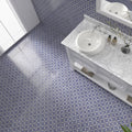 Alma Blue white ceramic vessel sink with polished chrome faucet set into marble countertop for modern bathrooms