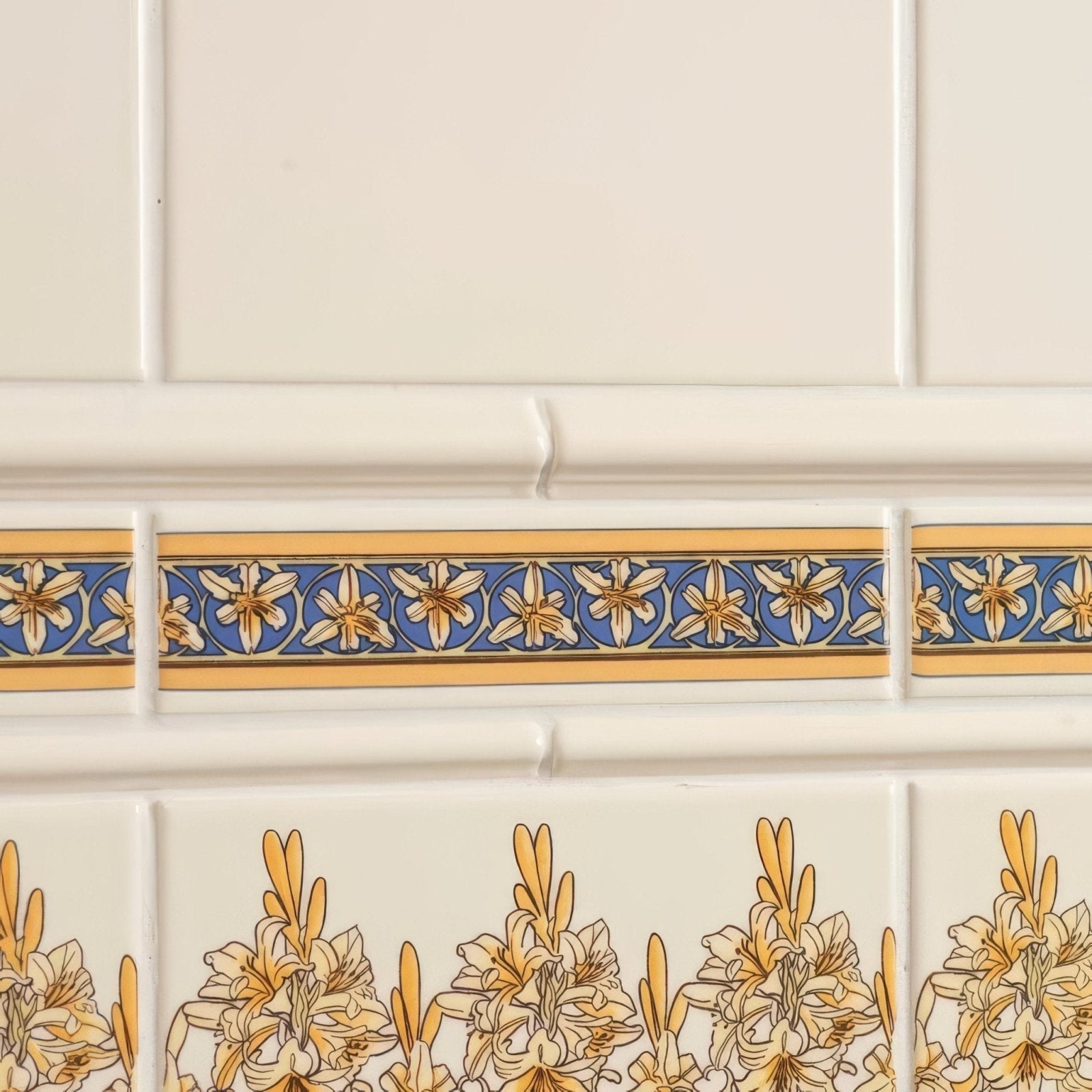 Beige ceramic wall tiles with a decorative blue and gold floral border from alphonse mucha orchid quarter tile on county white