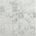 Alto white marble patterned mosaic tile with subtle gray veining and decorative etched designs on white marble