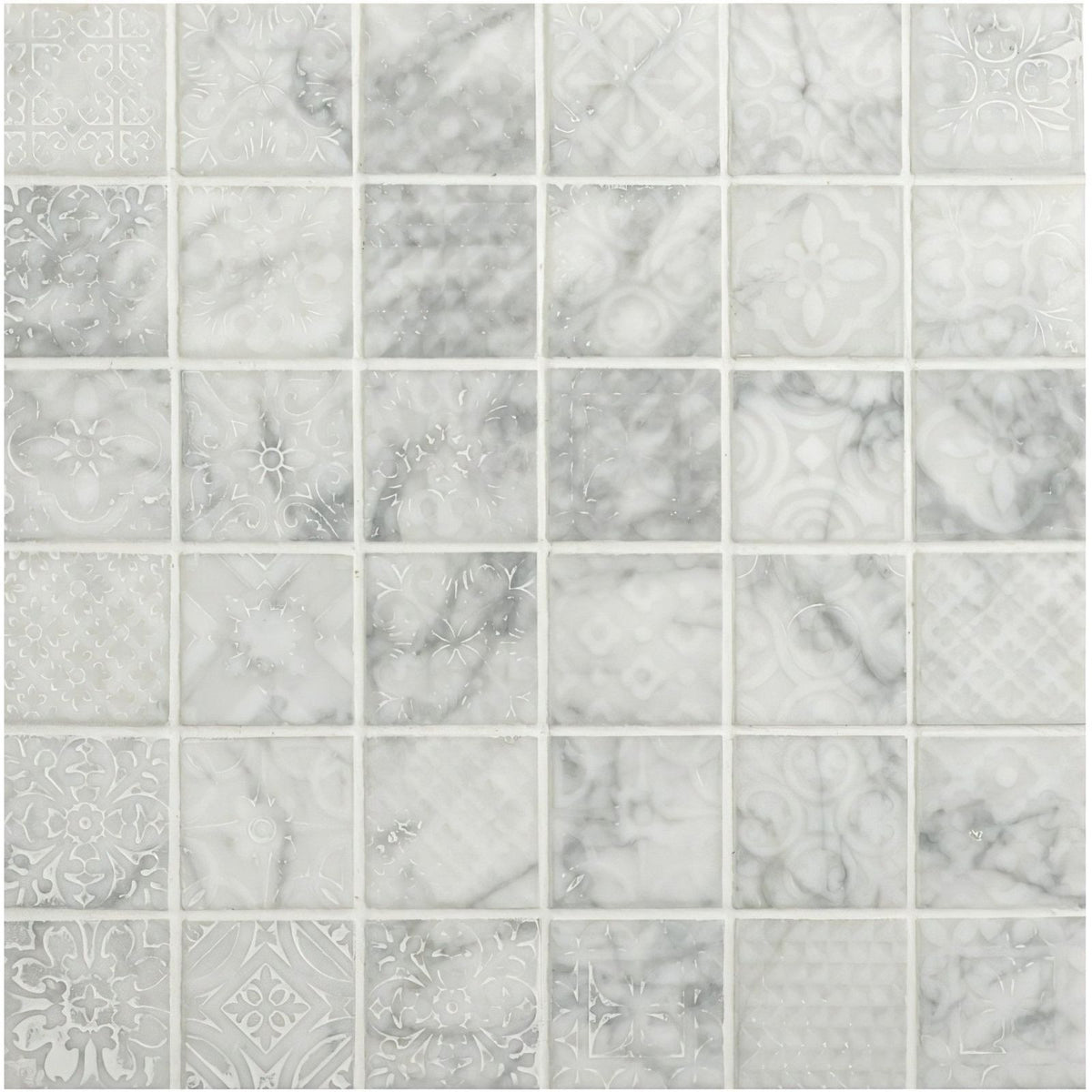 Alto white marble patterned mosaic tile with subtle gray veining and decorative etched designs on white marble