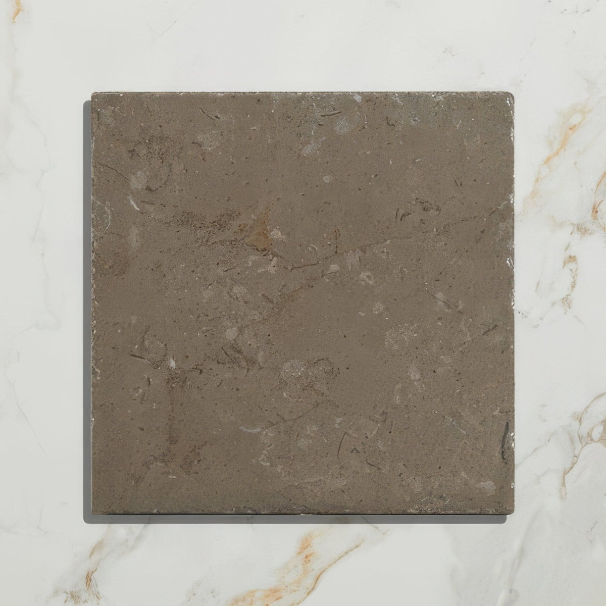 Amaya limestone tumbled cabochon square gray stone tile with matte finish subtle veining and rough texture