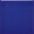 A glossy royal blue glazed square tile with a smooth reflective surface from the andalucia blue collection