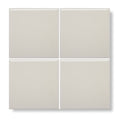 Four square glossy off-white ceramic tiles arranged in a grid from andalucia cream glazed tile collection