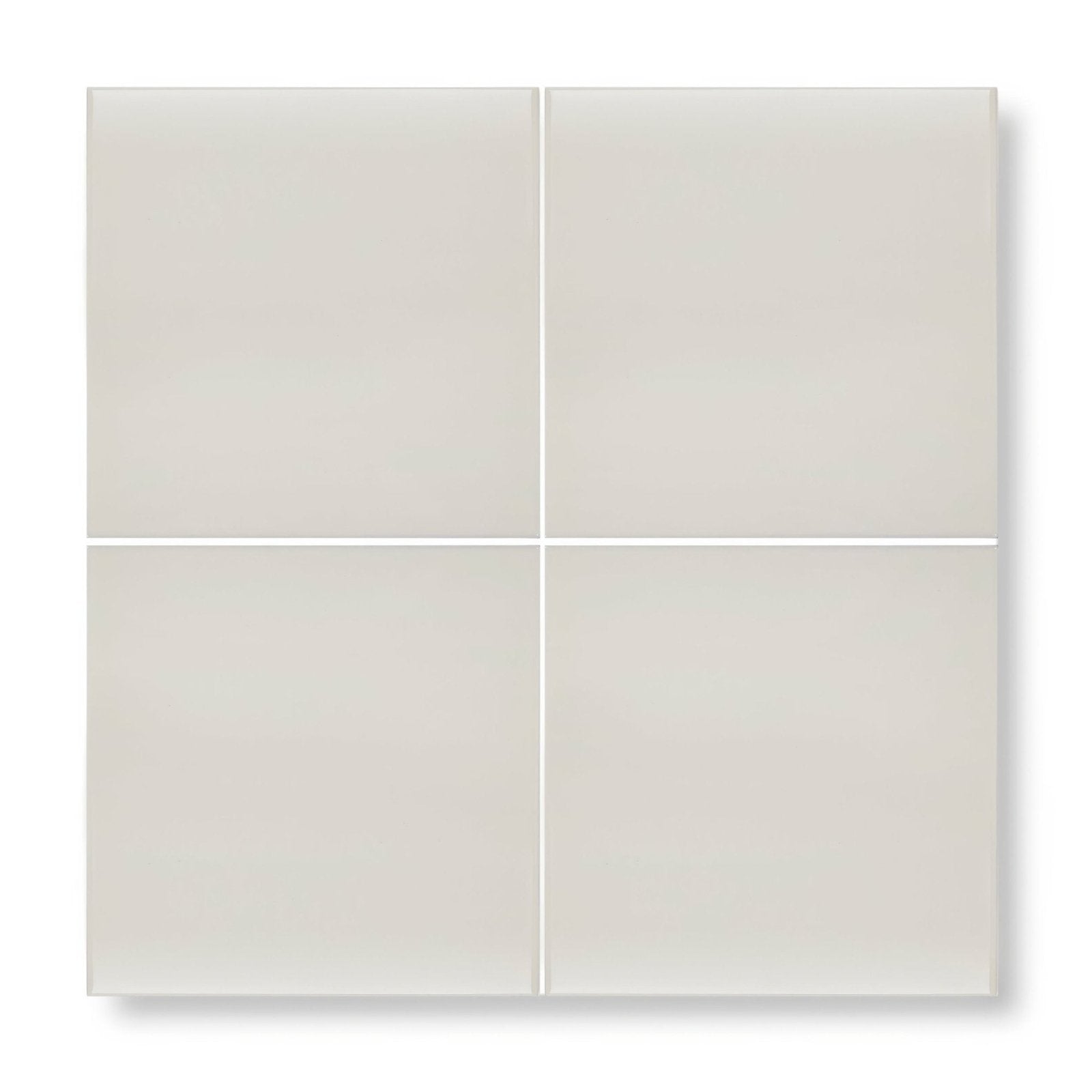 Four square matte-finished beige ceramic tiles arranged in a grid featuring andalucia cream glazed tile 20cm