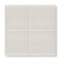 Four square matte-finished beige ceramic tiles arranged in a grid featuring andalucia cream glazed tile 20cm