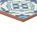 Square ceramic tile with white surface blue turquoise floral pattern and unglazed terracotta edge andalucia morena 20x20