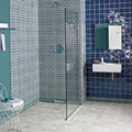 Glass shower enclosure with black frame and teal circular control panel featuring andalucia morena 20 x 20 patterned tile