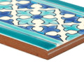 A rectangular ceramic tile with blue and white floral pattern and teal border from andalucia morena patterned border collection