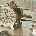 Antique mirror bevel silver clock with roman numerals and ornate detailing in an antique style design