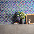 Aqua Scale Frosted iridescent fish-scale glass mosaic styled with a dark grey ceramic vase and green foliage