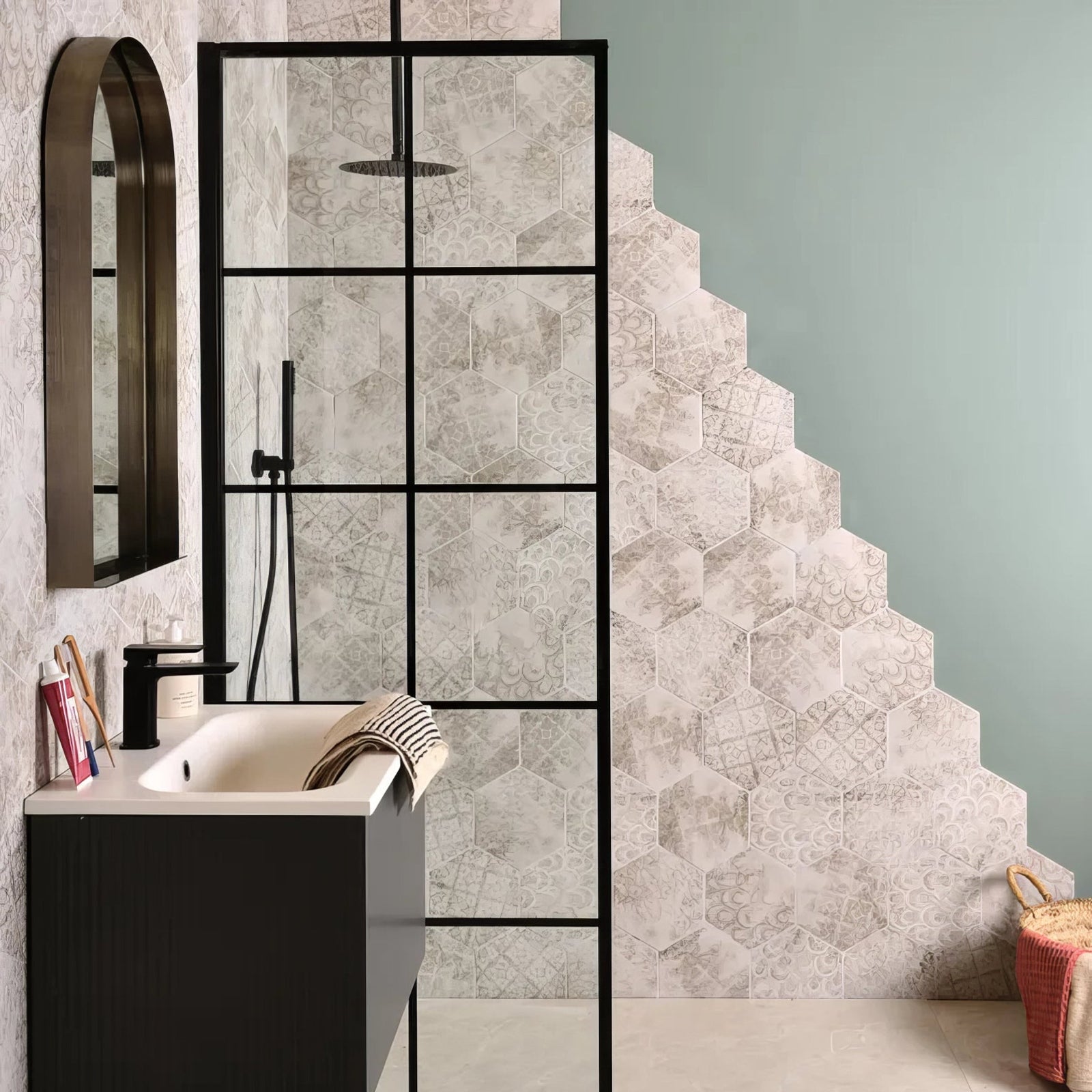 Architectural Elements Porcelain Melange hexagonal bathroom tiles in muted gray and white with embossed floral designs