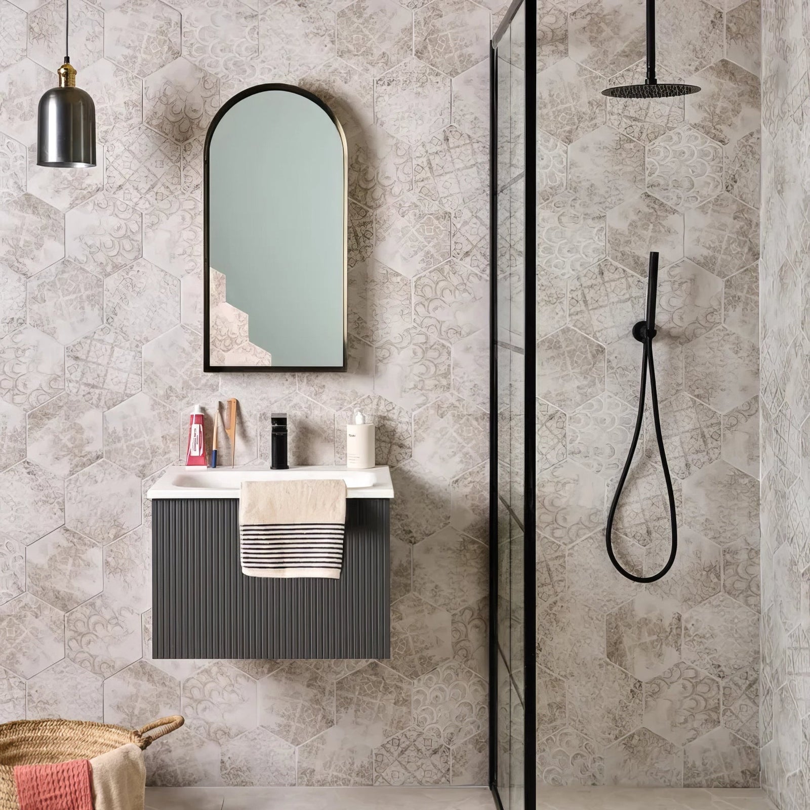Modern black-framed arched porcelain melange mirror with a light mint-green reflective surface for architectural elements