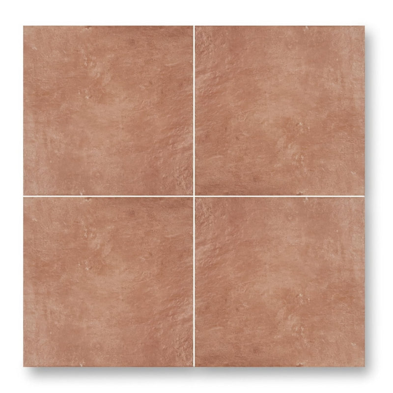 Four square terracotta effect tiles with a textured matte finish arranged in a grid for indoor wall or floor use