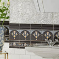 Art deco black fan ceramic tiles with real platinum and gold geometric patterns on a bathroom wall