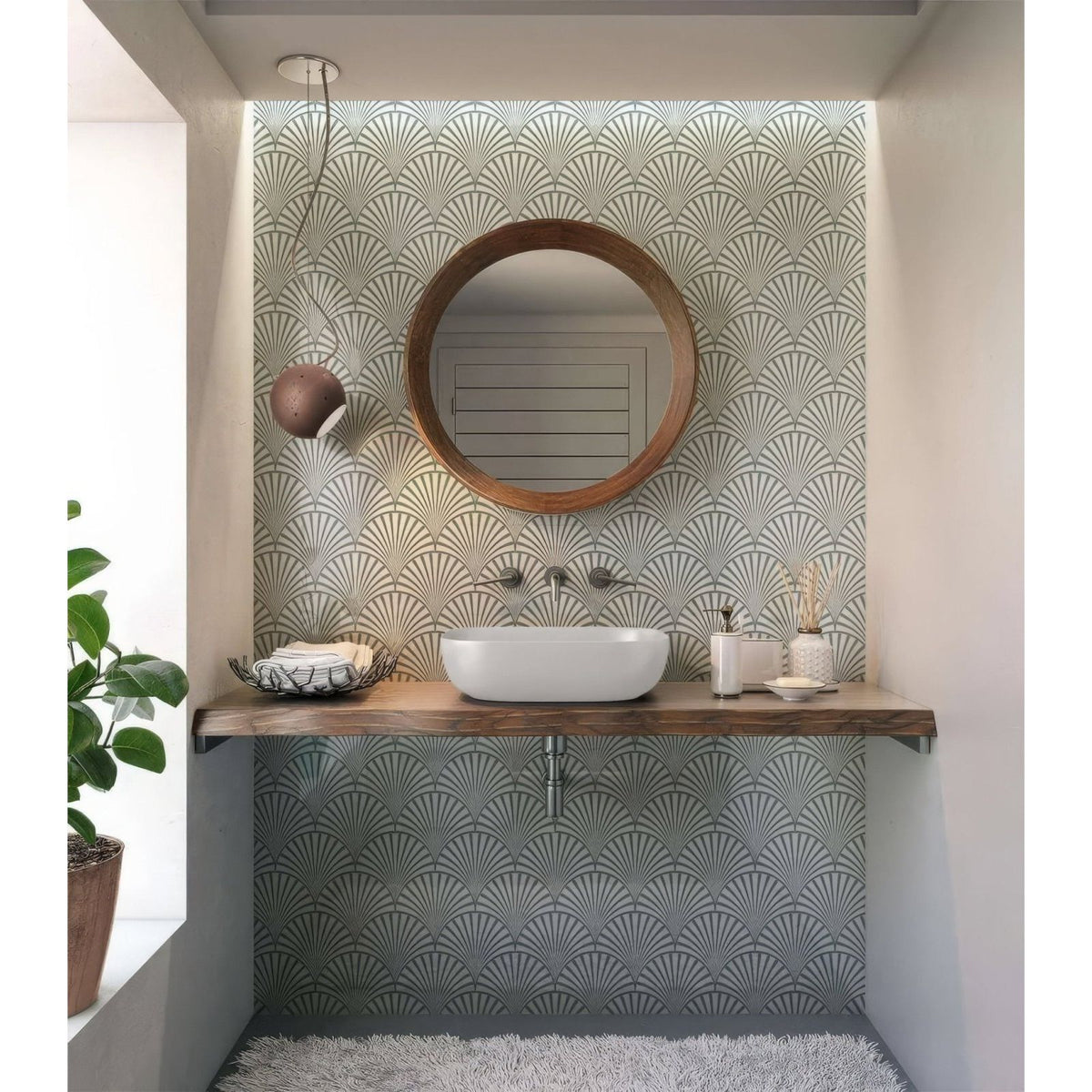 Art deco decorative fan shower panel with round wooden-framed mirror above white vessel sink for bathroom use