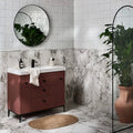 Maroon bathroom vanity with black metal legs and round knobs featuring blanco porcelain top by arte italiano