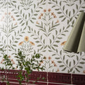 White ceramic wall tiles with delicate green vines and soft pink and yellow flowers arts and crafts flora pink 60x30cm