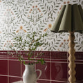 White ceramic pitcher with handle holding green eucalyptus branches in arts & crafts flora pink 60x30cm product