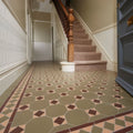 The arundel brown buff and green vintage-style hexagonal floor tiles in muted olive green and terracotta brown arranged geometrically
