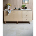 Light wood grain sideboard with marble countertop and brass handles featuring ascoli porcelain avorio 40 x 60cm tile