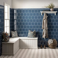 White l-shaped bench with cushioned seat vertical paneling and two patterned throw pillows in ascot blue field tile