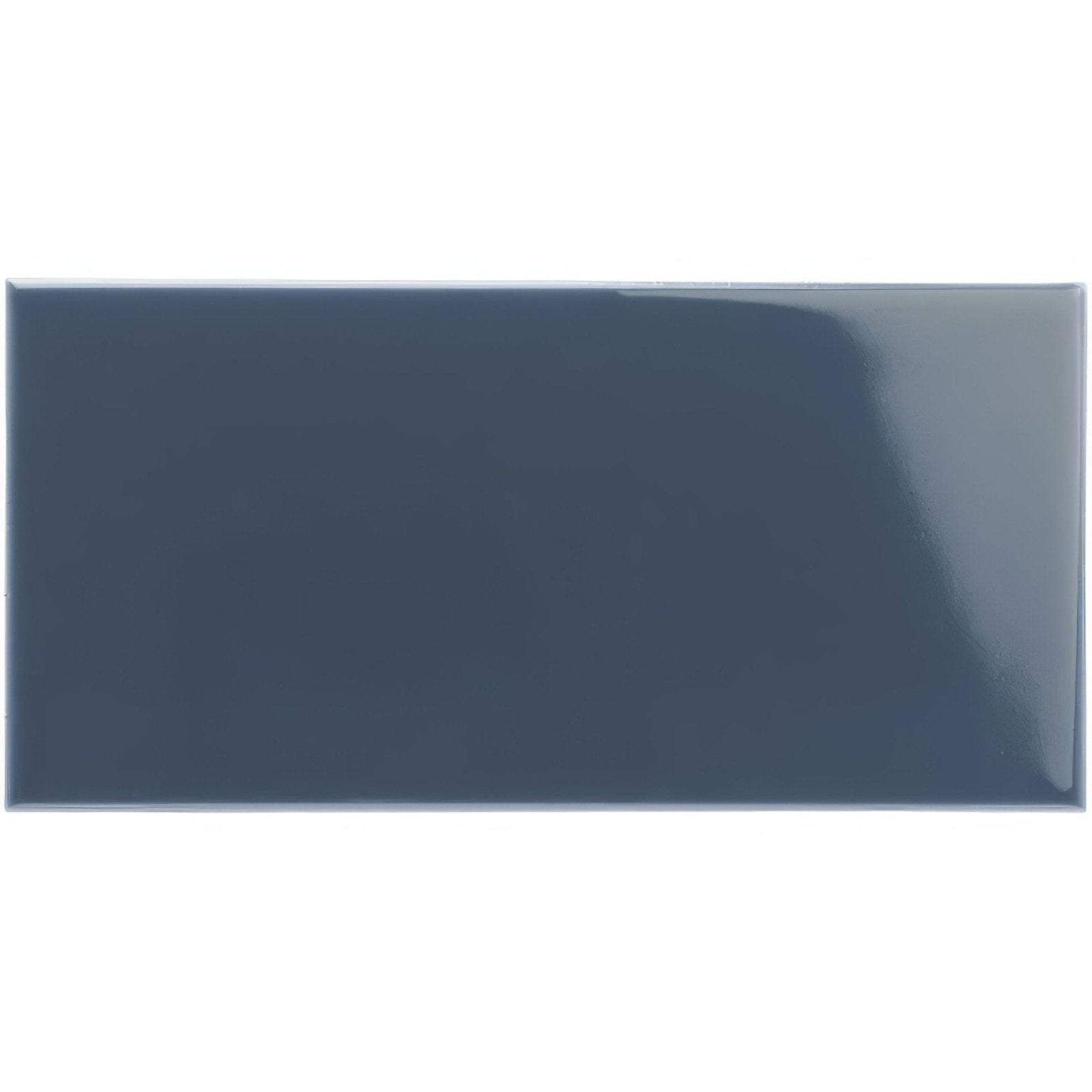 A sleek glossy dark gray rectangular ceramic tile with a smooth reflective surface ascot blue half tile
