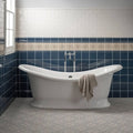 White porcelain clawfoot bathtub with classic curved design and chrome faucet in ascot blue sigma moulding style