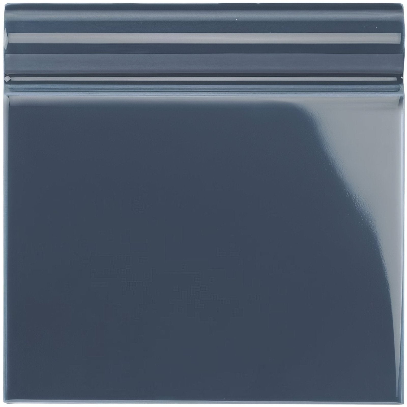 Dark blue glossy ceramic ascot blue skirting tile with subtle horizontal ridge detail along the top edge