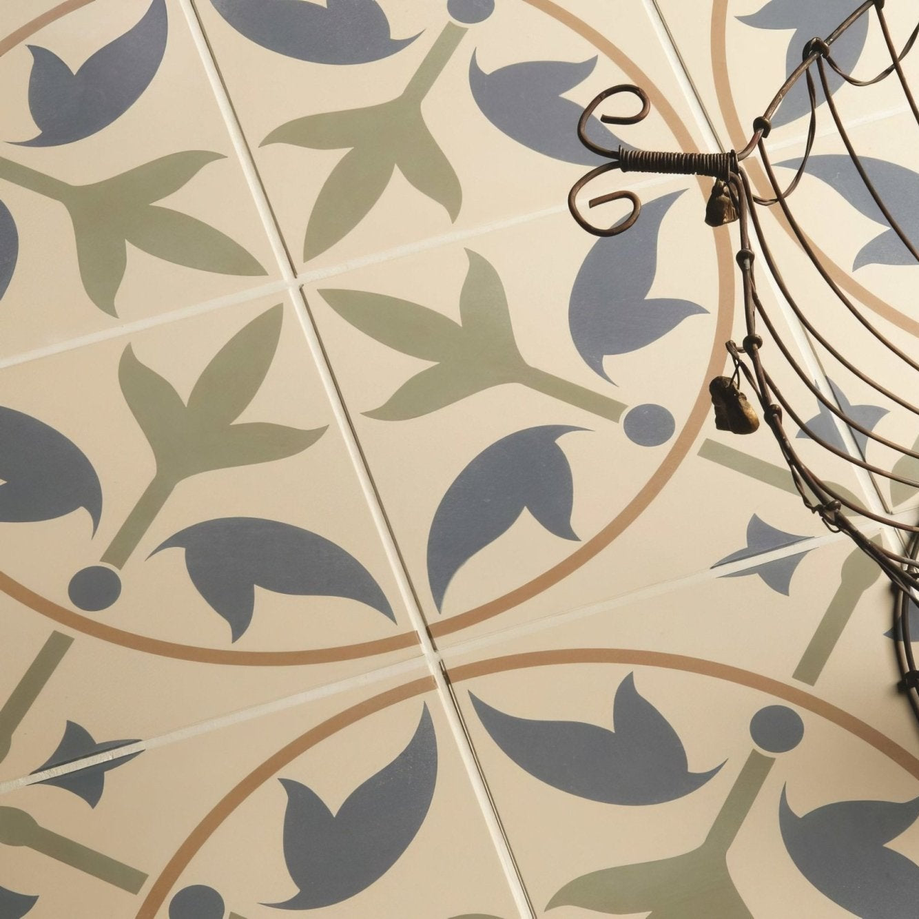 Beige and blue floral patterned ceramic floor tiles with vintage design in assyrian dublin denim and old london on white