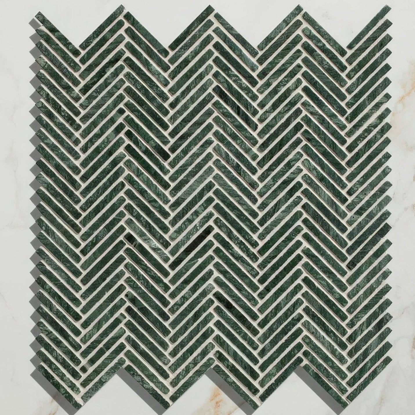 Dark green marble mosaic tiles in a herringbone pattern for athens amazon marble mosaic product design
