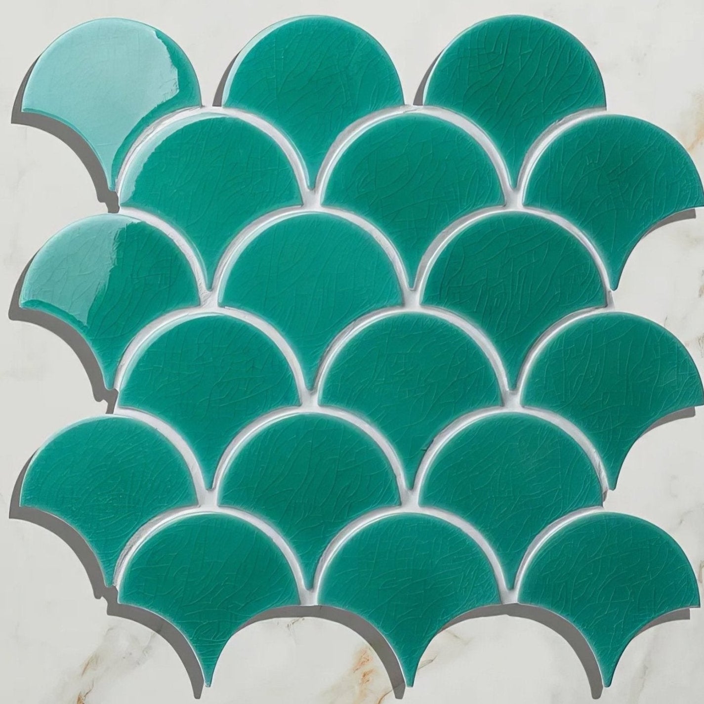 Teal fish-scale mosaic tile with glossy finish and white grout lines from atlantis porcelain mosaic emerald collection
