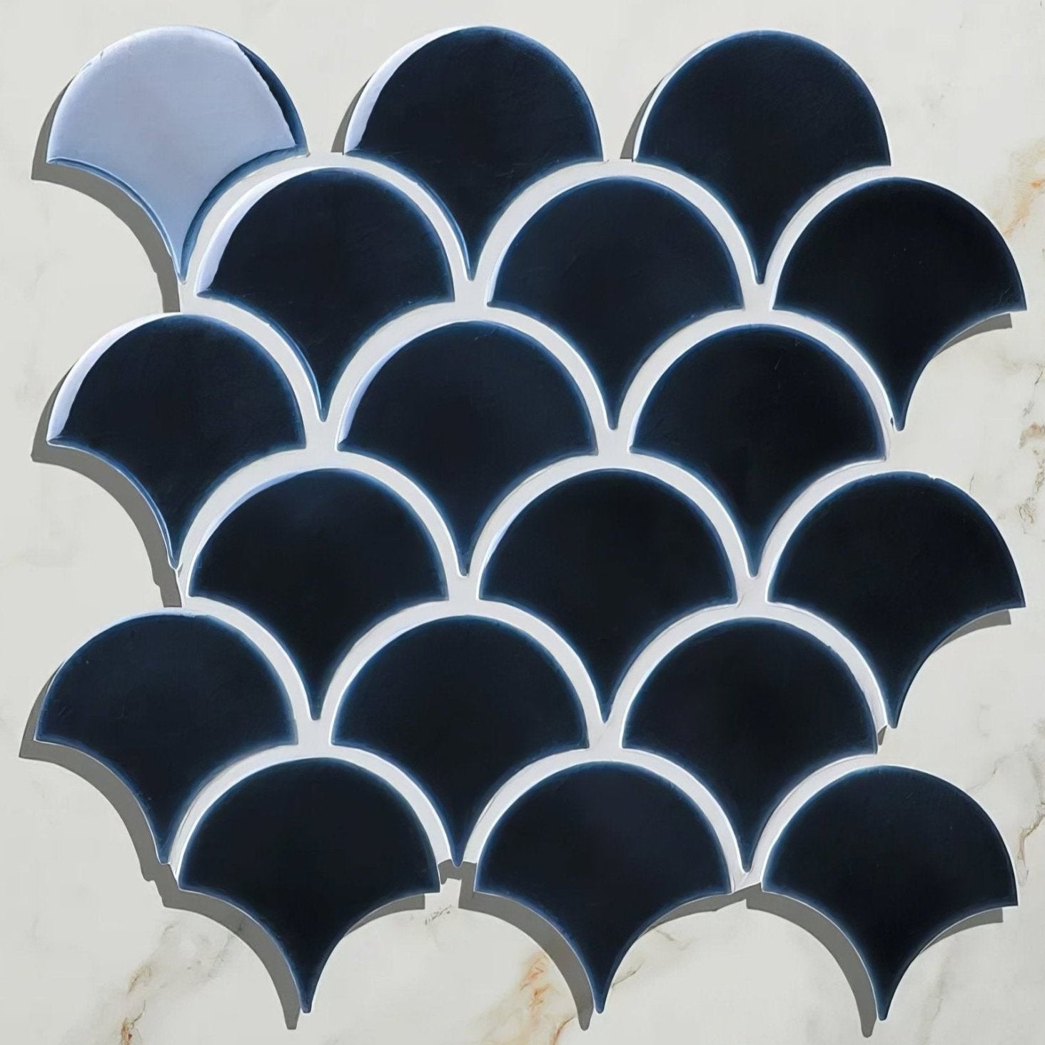Dark blue scalloped ceramic tiles with glossy finish arranged in overlapping fish scale pattern atlantic porcelain mosaic navy