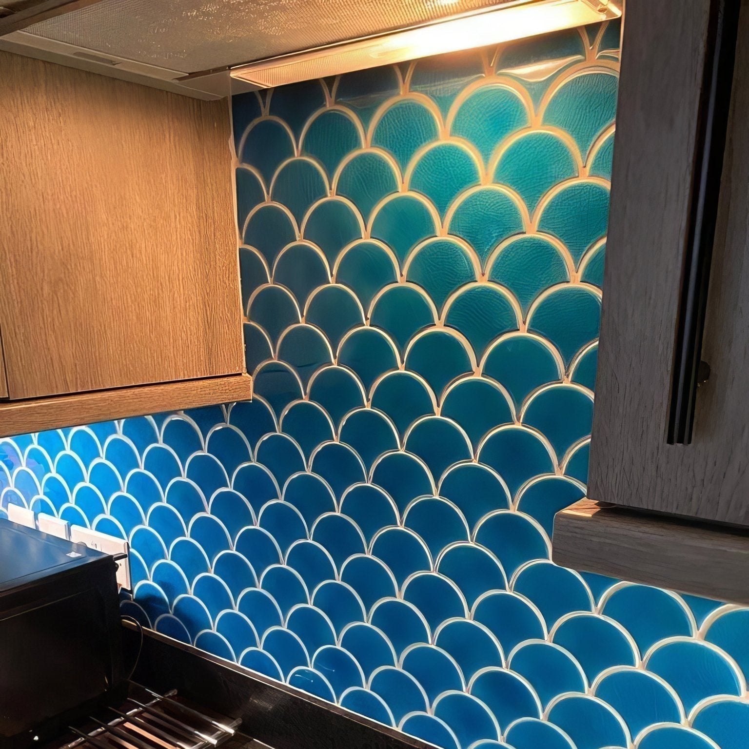 Vibrant blue atlantis porcelain mosaic ultramarine fish-scale tile backsplash with glossy finish and white grout lines
