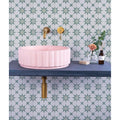 Pink ribbed ceramic vessel sink in atlas porcelain green product showcasing textured design and durable material