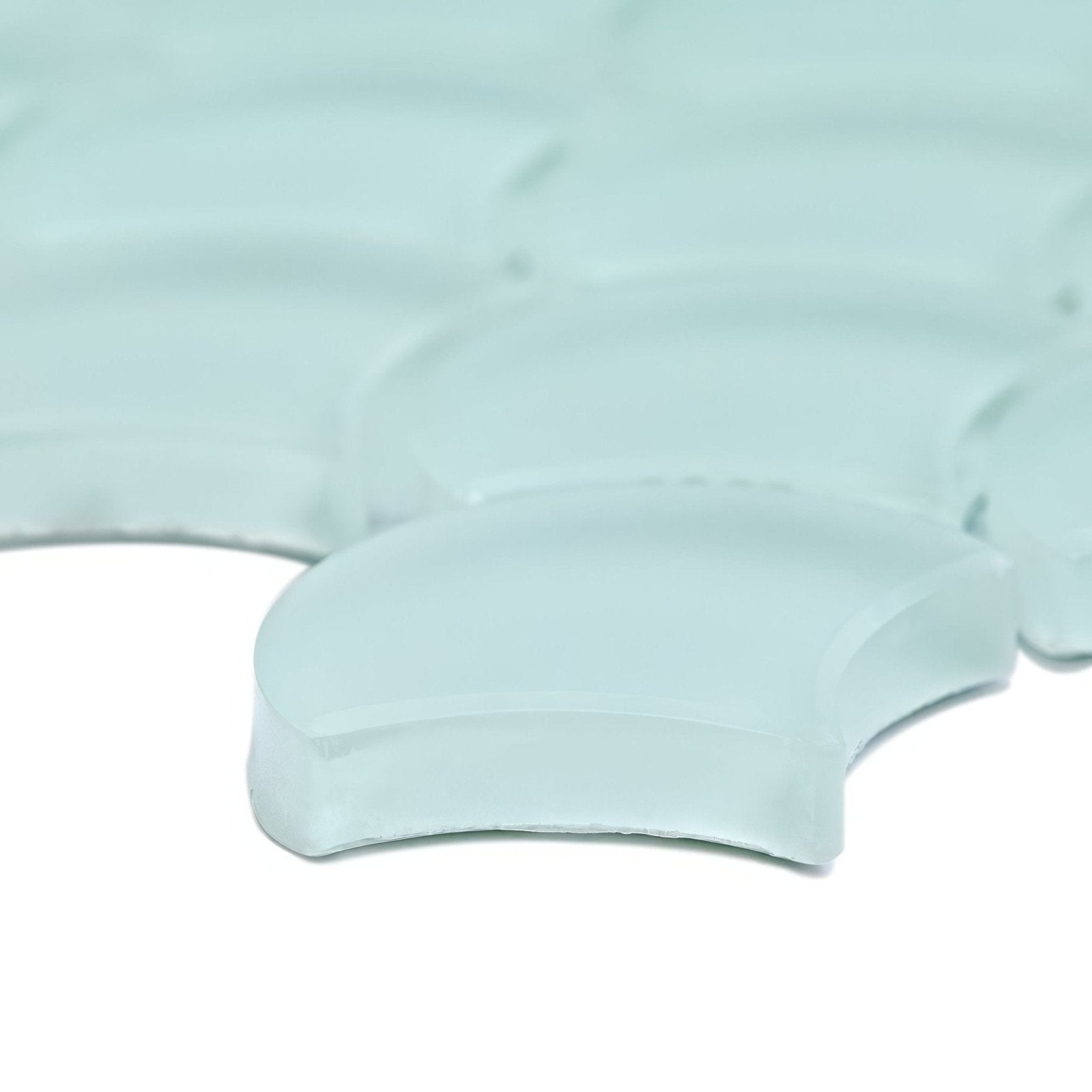 Translucent light blue glass mosaic tiles with smooth curved design from aurora fan green mosaic collection