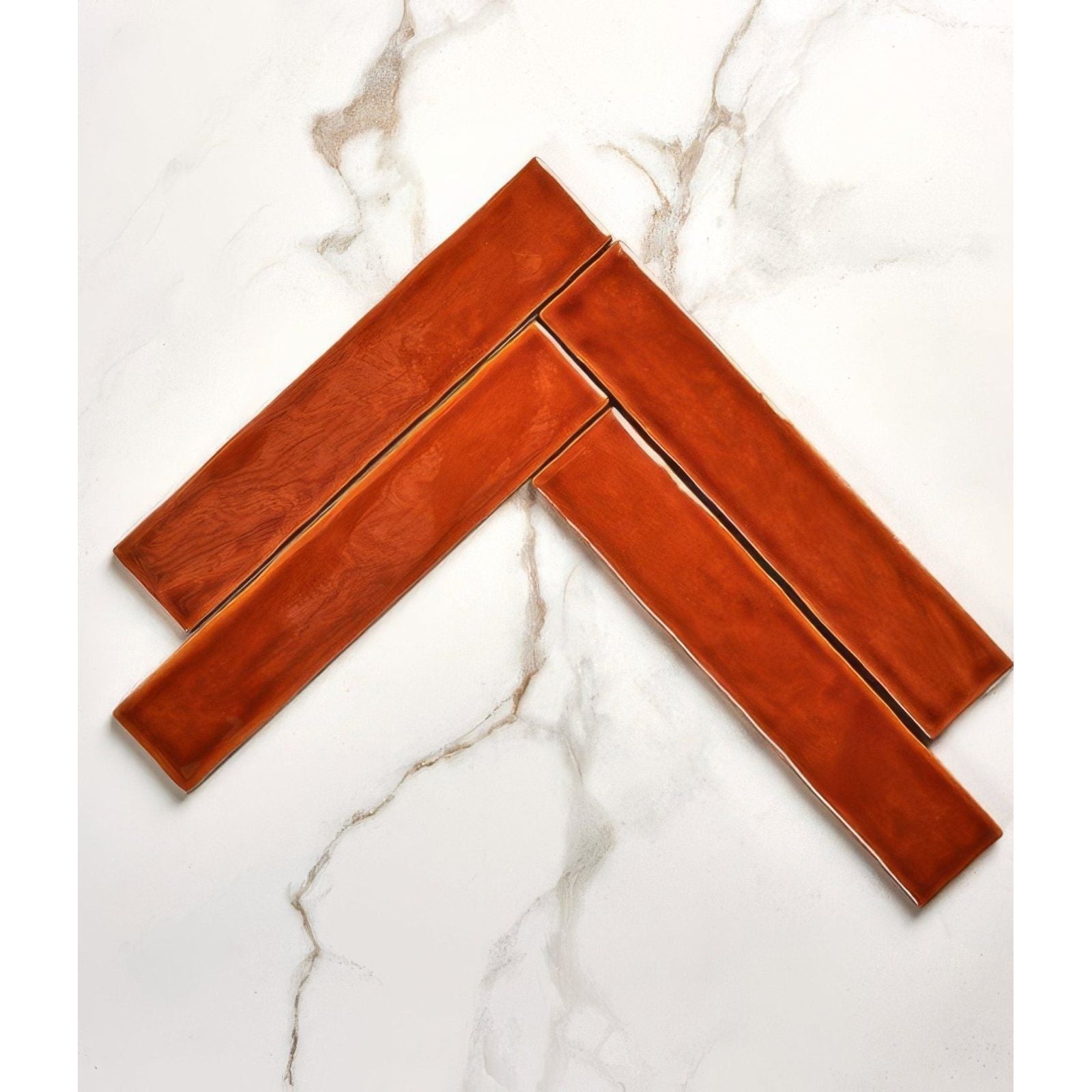 Avebury ceramic burnt caramel ceramic tiles with warm terracotta hue and subtle glossy finish in herringbone pattern