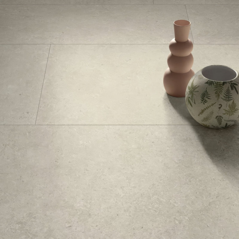 A matte-finished light beige ceramic tile with subtle natural veining axis ivory 60 x 60cm