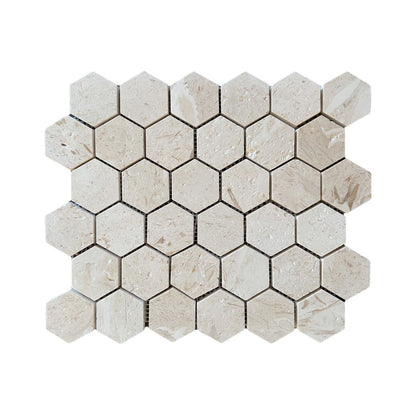 Mesh-backed sheet of Shellstone brushed limestone hexagon mosaic in warm beige tones