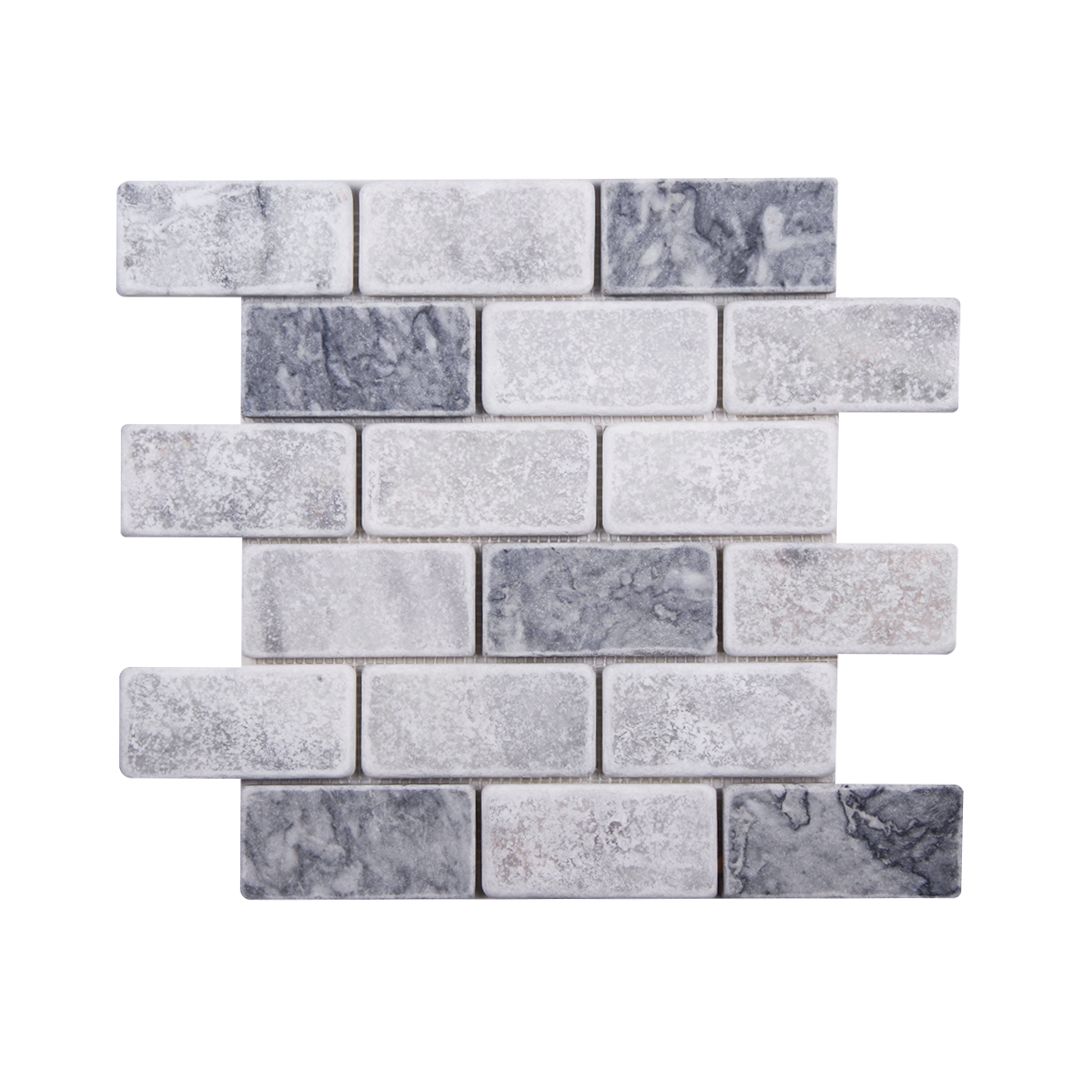 Tumbled marble brick mosaic sheet mixing Carrara white and Platinum Grey pieces in a running bond