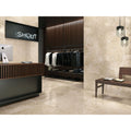 Baltimore 1821 Caramel Polished beige marble-effect tiles on the walls of a minimalist retail interior with dark wood accents