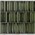 Green ceramic bamboo lustre porcelain mosaic tile with glossy textured finish and subtle black veining forest color