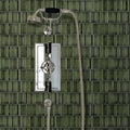 Bamboo Lustre Porcelain Mosaic Forest dark green ribbed porcelain mosaic in a shower with a chrome fixture