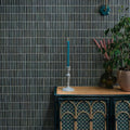 Bamboo Lustre Porcelain Mosaic Teal teal ribbed porcelain mosaic styled with a blue candle in a ceramic holder