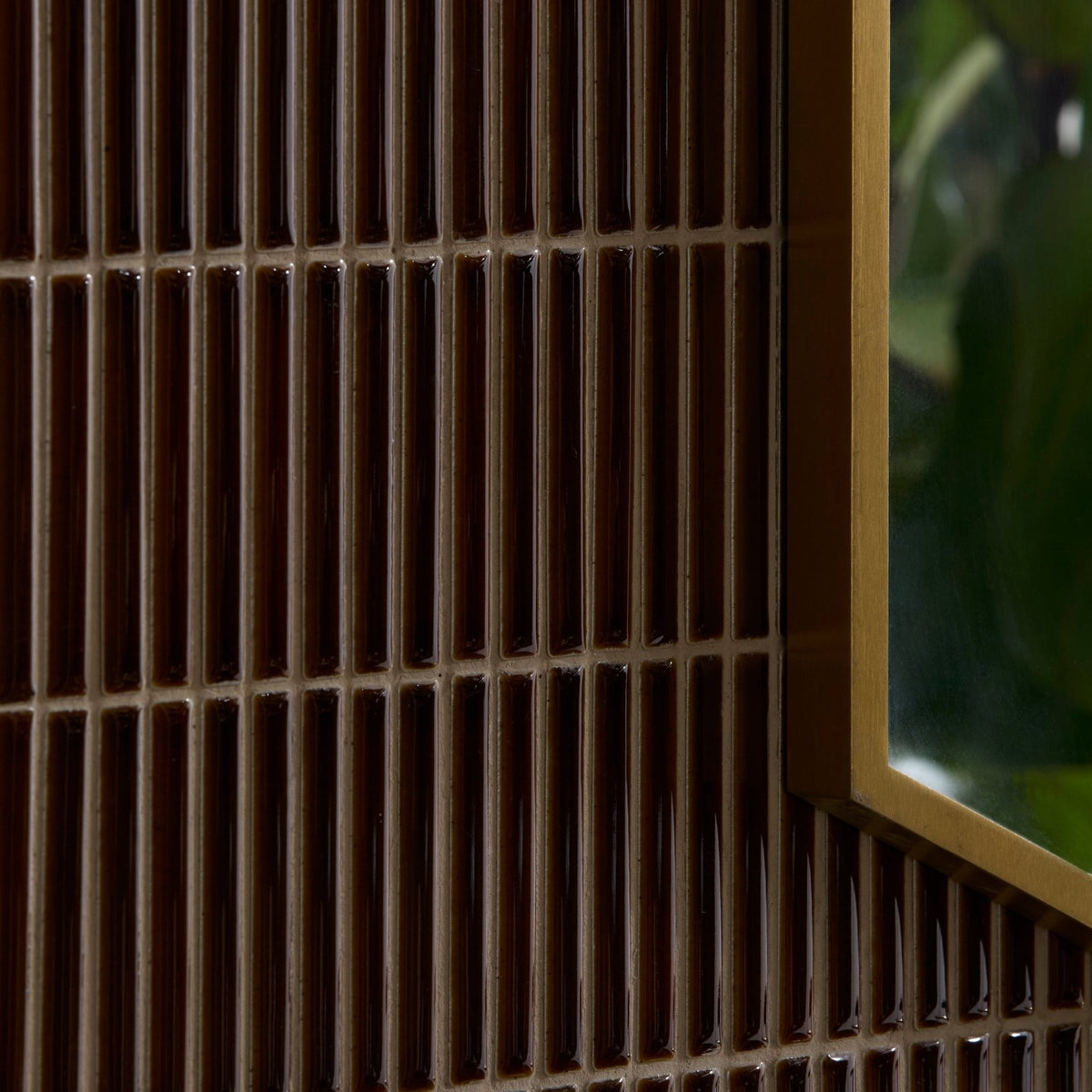 Dark brown ceramic tiles with gold-toned metallic framing arranged in a vertical grid pattern for bamboo porcelain mosaic caramel