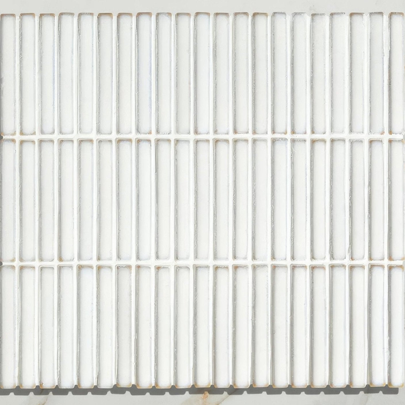 White rectangular bamboo porcelain mosaic tile with smooth glossy finish arranged in vertical rows