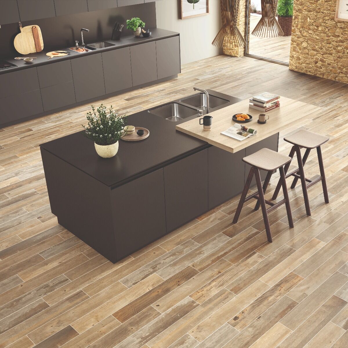 Modern dark gray kitchen island with black countertop and integrated sink on barnwood aged oak wood-veneer tiles